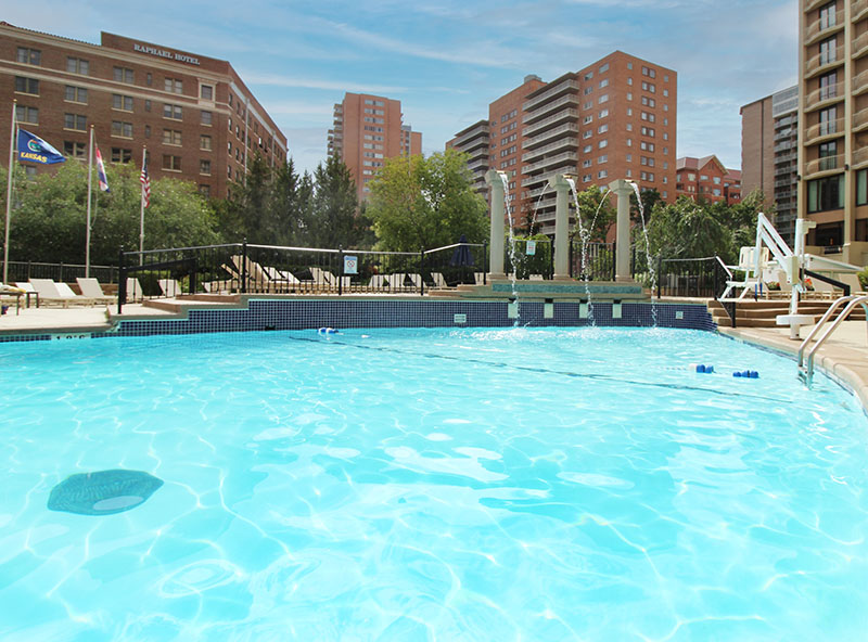 Urban swimming pool surrounded by tall buildings — city pool construction and commercial renovation.