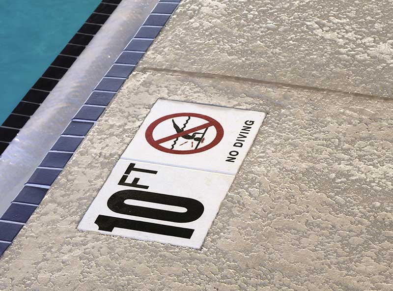 White tile marker showing pool depth of 10 feet.