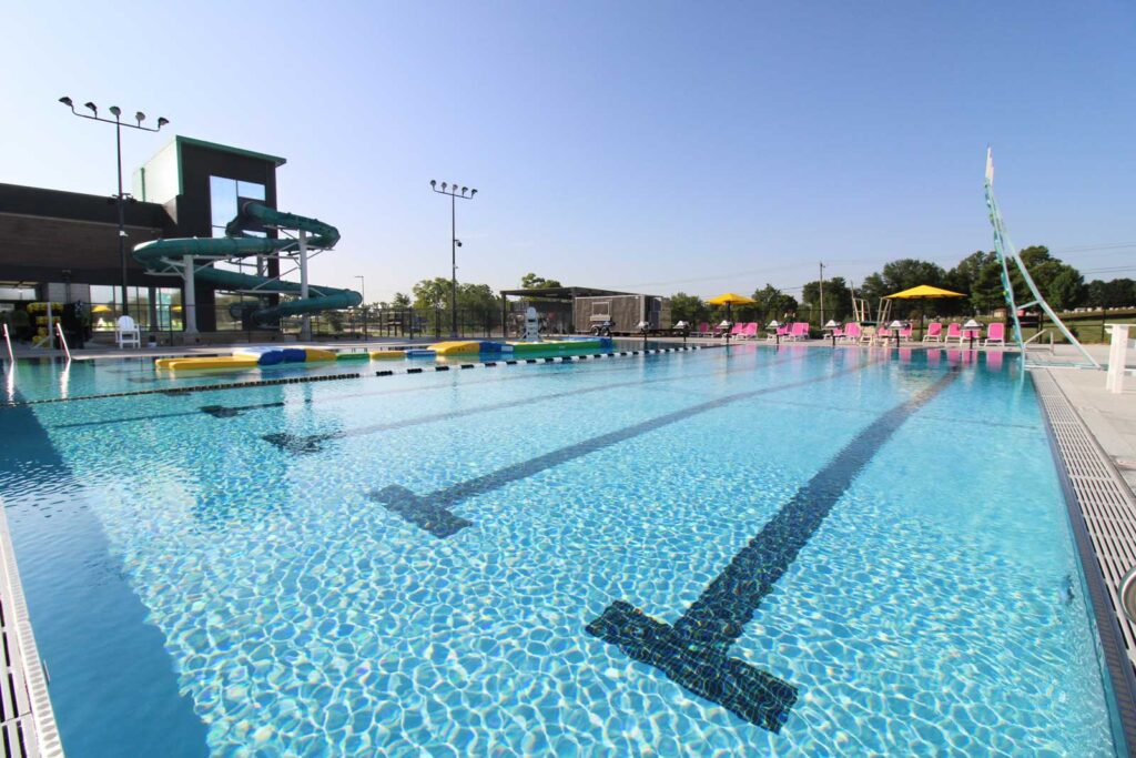 Outdoor swimming pool with lane markers — aquatic facility renovation and competitive pool design