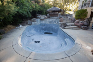 Empty swimming pool ready for renovation
