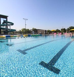 Outdoor swimming pool with lane markers — aquatic facility renovation and competitive pool design